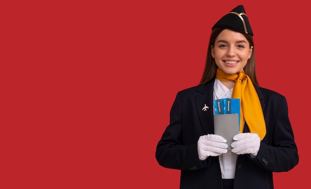 Free Photo portrait of flight attendant with plane tickets and passport