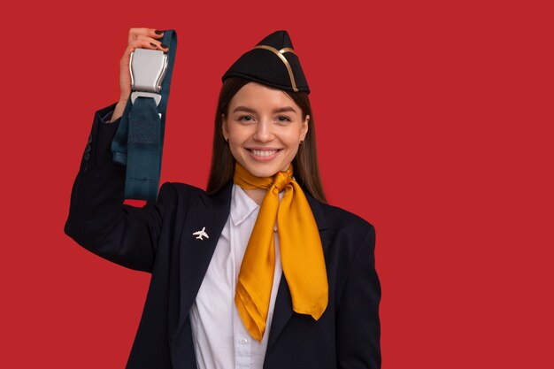 Portrait of flight attendant with safety belt