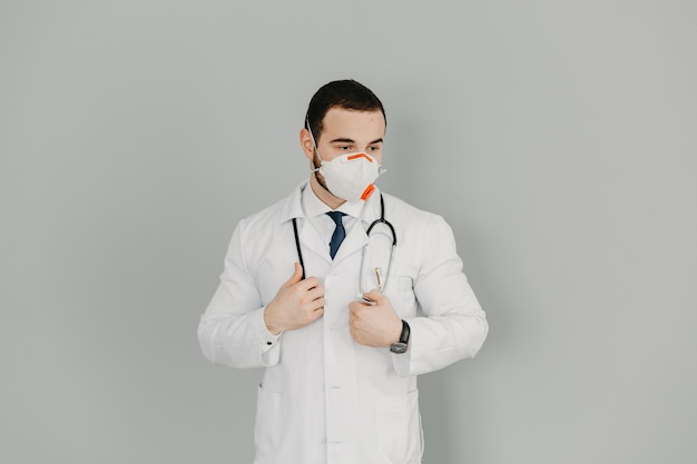 Portrait of a friendly doctor Isolated on gray