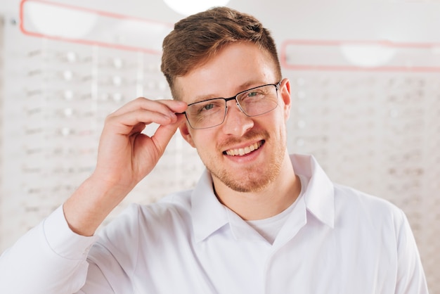 Free Photo portrait of friendly male optometrist