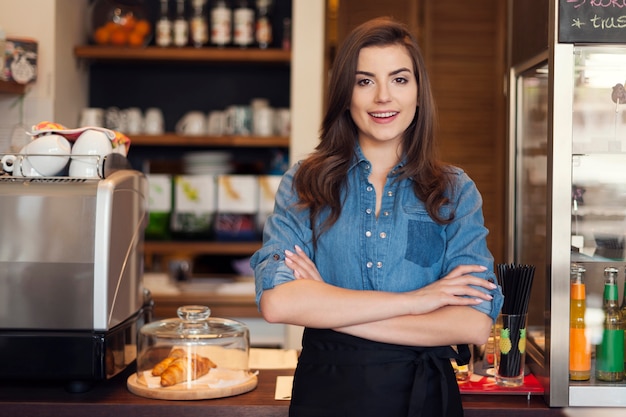 Free photo portrait of friendly waitress at work