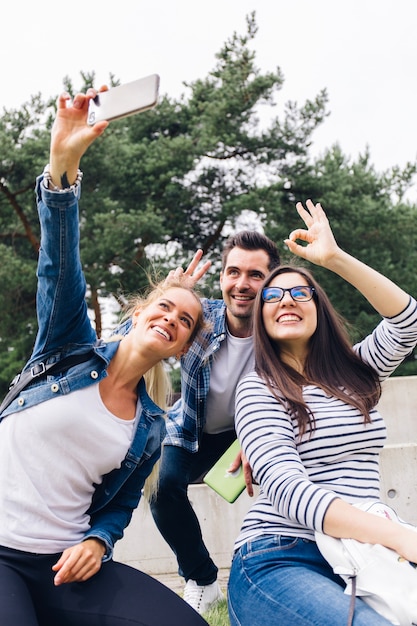 Portrait of friends making selfie