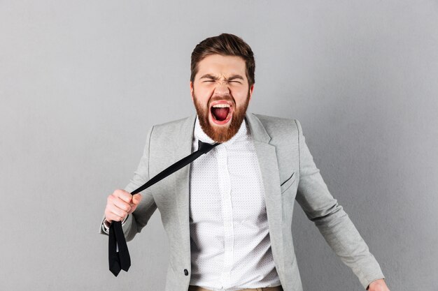 Portrait of a furious businessman dressed in suit