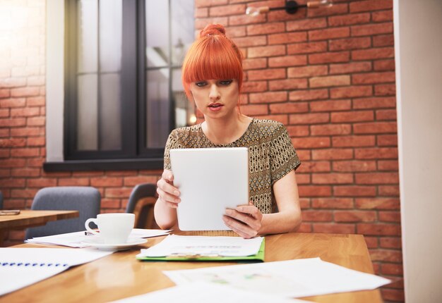 Portrait of ginger woman at the office