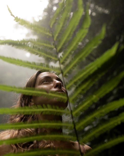 Free Photo portrait of a girl on a background of the jungle