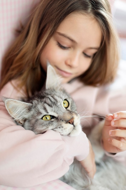 Free Photo portrait of girl and cat