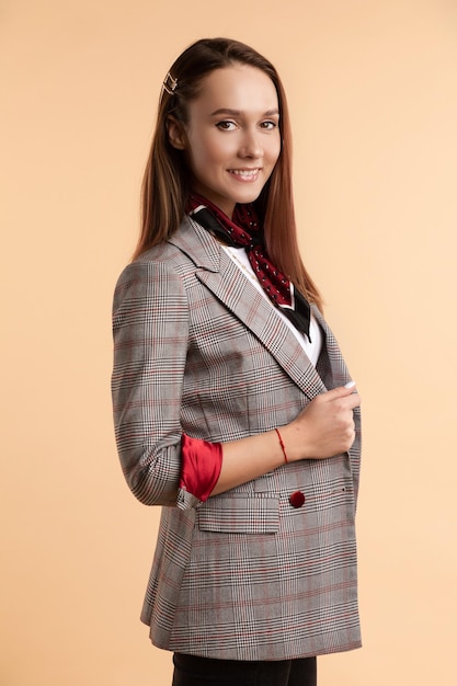 Free Photo portrait of girl in jacket and white shirt looking at camera