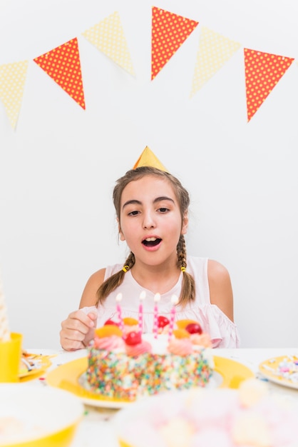 Free Photo portrait of a girl ready to blow birthday candle