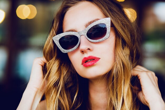 Portrait of glamour stylish blonde lady with cool retro sunglasses