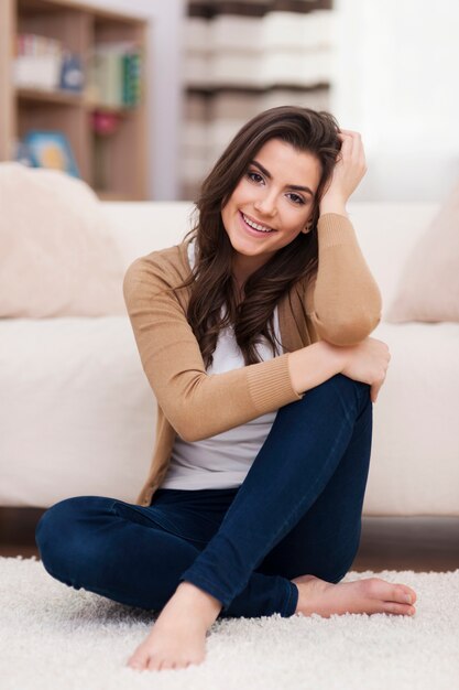 Portrait of gorgeous natural woman in living room