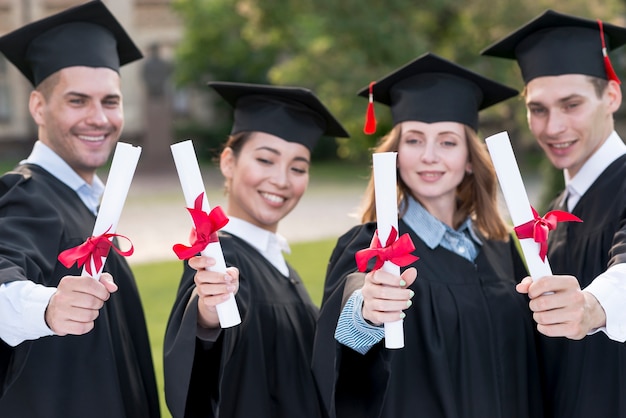 Portrait of group of students celebrating their graduation