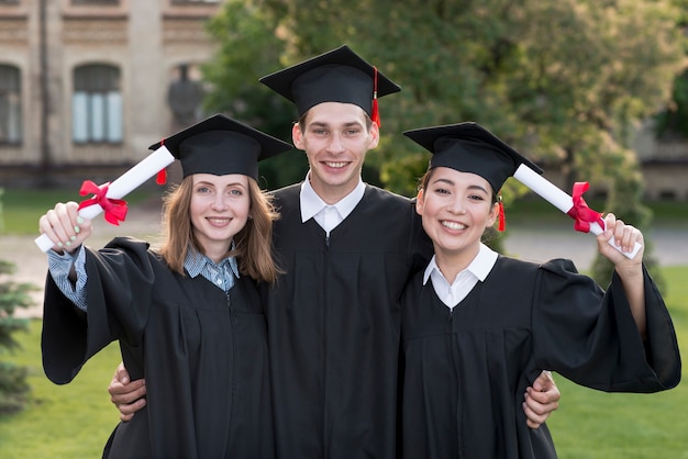 Portrait of group of students celebrating their graduation