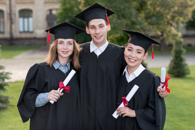 Portrait of group of students celebrating their graduation