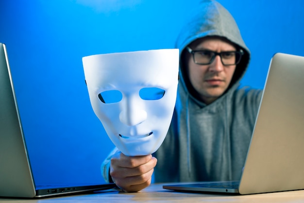 Portrait of hacker with mask