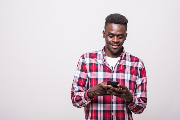 Portrait of handsome afro man sending and getting messages to his lover isolated