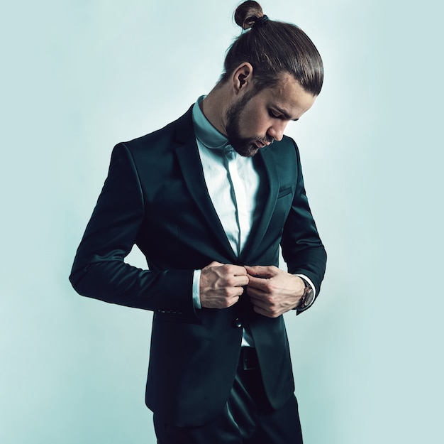 Free photo portrait of handsome fashion stylish hipster businessman model dressed in elegant black suit.