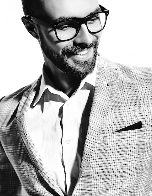 portrait of handsome fashion stylish hipster businessman model dressed in elegant light blue suit in glasses on white