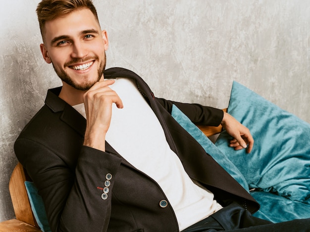 Free Photo portrait of handsome hipster  businessman model wearing casual black suit. 