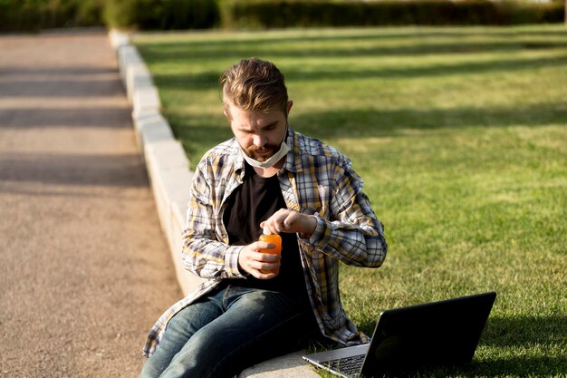 Portrait of handsome male holding juice bottle