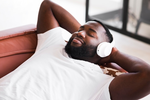 Portrait of handsome man listening to music