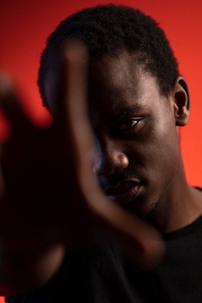 Portrait of handsome man over orange background