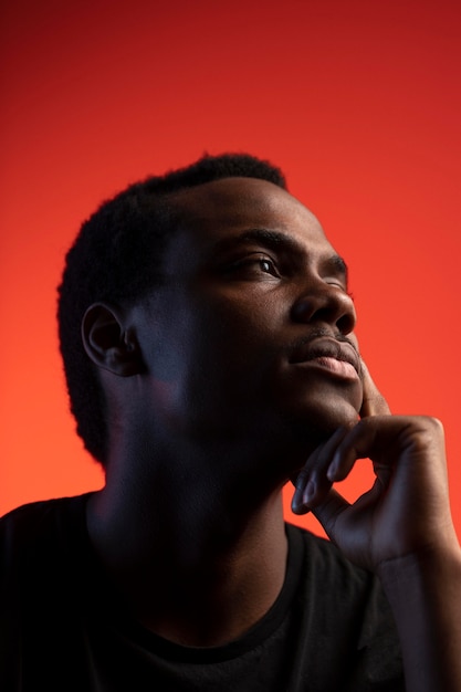 Portrait of handsome man over orange background