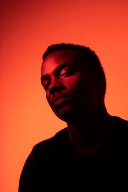 Portrait of handsome man over orange background