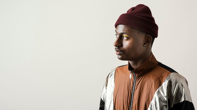 Portrait of handsome man wearing make-up with copy space