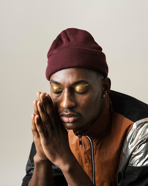 Portrait of handsome man wearing make-up