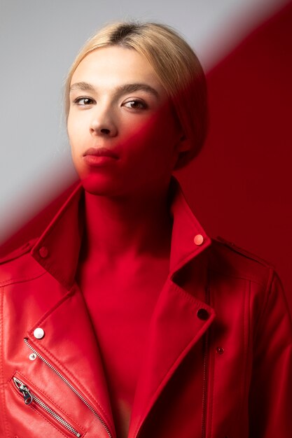 Portrait of handsome man with long blonde hair and red jacket