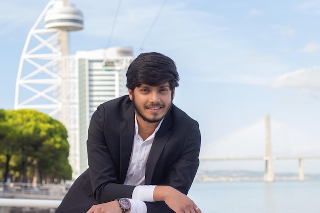 Free Photo portrait of handsome smiling arabic man. attractive young businessman in suit with beard and moustache looking at camera. portrait, international, beauty concept