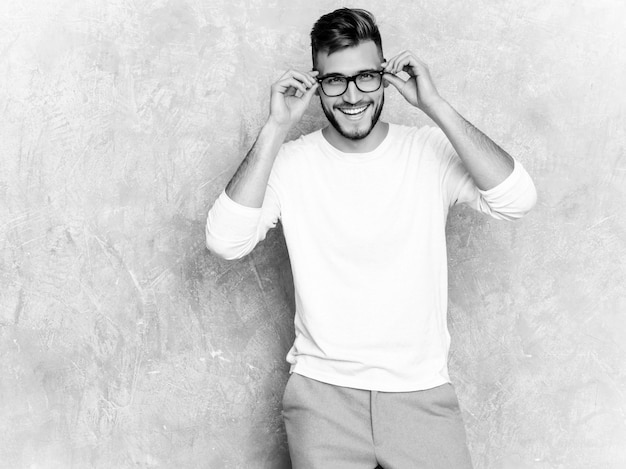 Free Photo portrait of handsome smiling hipster   businessman model wearing casual summer white clothes 