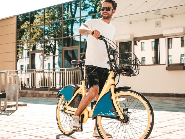 Portrait of handsome smiling stylish hipster lambersexual model