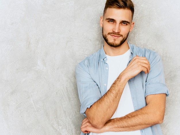 Free photo portrait of handsome smiling young man model wearing casual shirt clothes. fashion stylish man posing