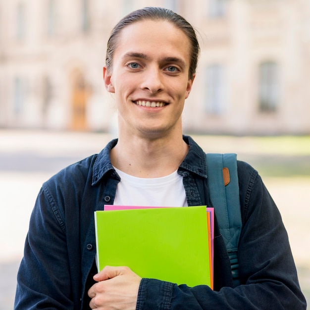 Portrait of handsome student smiling