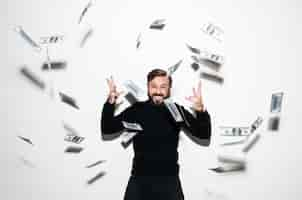 Free photo portrait of a happy bearded man celebrating success