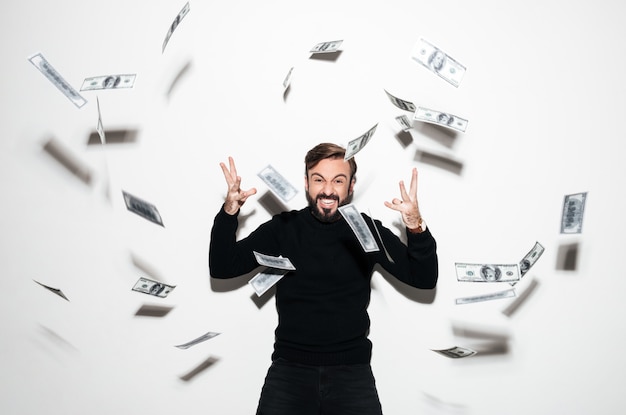 Portrait of a happy bearded man celebrating success