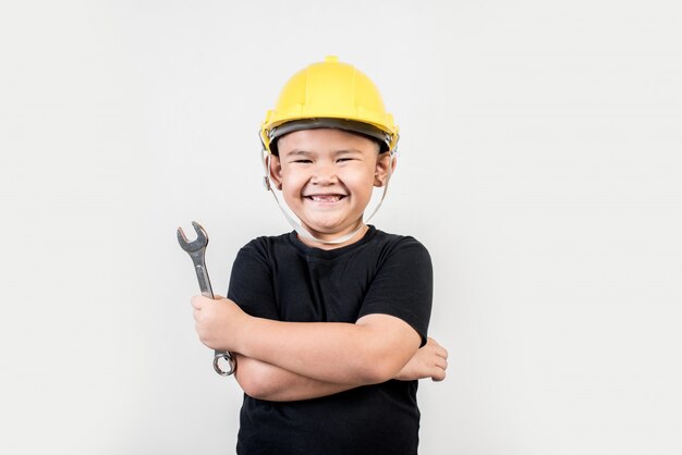 Portrait Happy boy wearing engineer hat