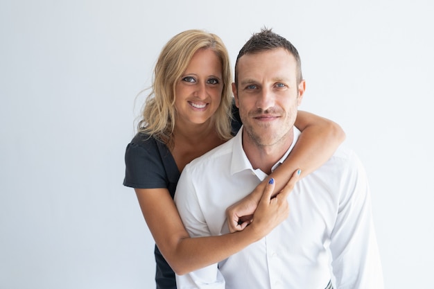 Free photo portrait of happy caucasian mid adult couple smiling at camera.