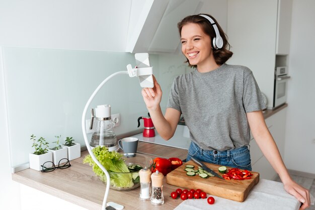 Portrait of a happy cheerful woman with headphones