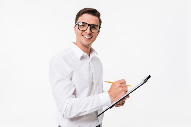 Portrait of a happy confident guy in white shirt