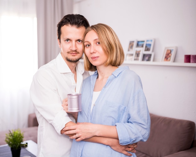 Portrait of happy couple at home