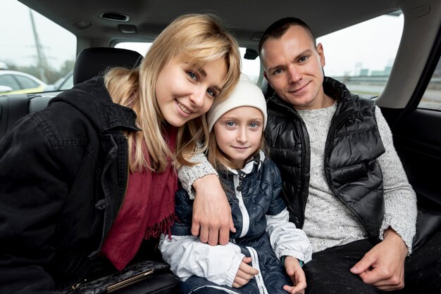 Portrait of happy family in car