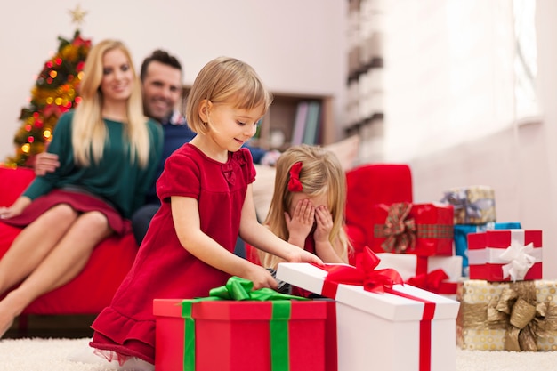 Portrait of happy family playing during the christmas time