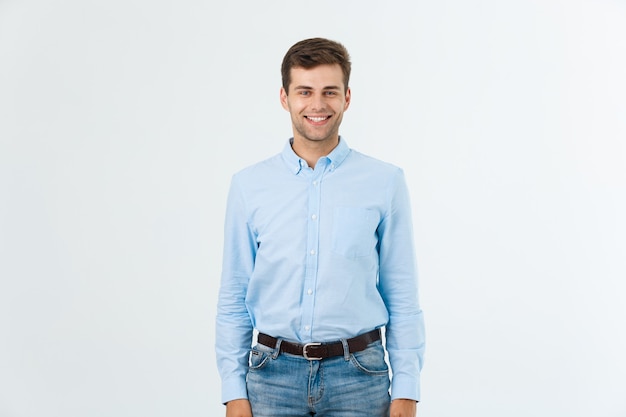 Portrait of happy fashionable handsome man in jeans and blue shirt look at camera.