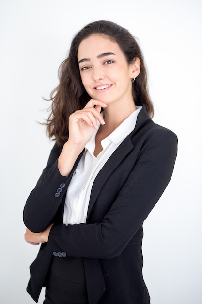 Portrait of happy female manager touching face