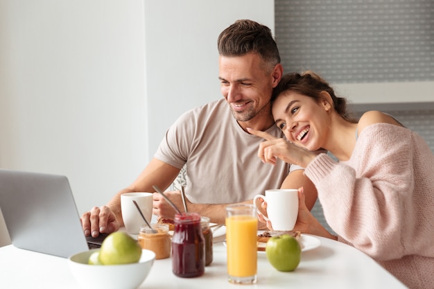 Portrait of a happy loving couple having breakfast