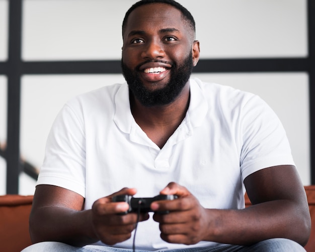 Portrait of happy male playing video games