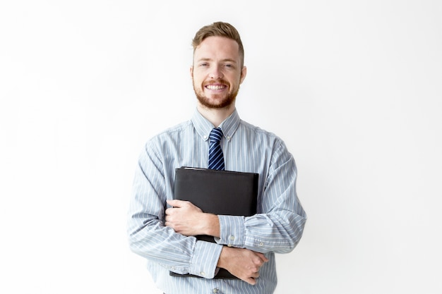 Free photo portrait of happy manager holding leather case