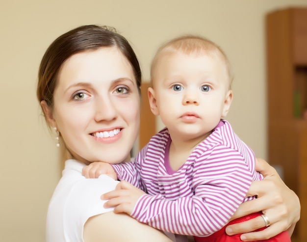 Portrait of happy mother with toddler